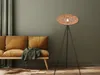 A living room scene with a sofa and a floor lamp. Produktbild-Vorschau