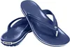 A pair of navy blue Crocs flip-flops with white trim, shown against a white background. Produktbild-Vorschau