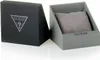A black Guess branded box and an open grey box with a grey cushion inside, likely for a watch. Náhľad obrázku produktu