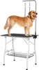 A golden retriever dog stands on a grooming table. Voir les images du produit