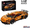 An orange Lamborghini toy car model and its packaging are displayed against a white background. Voir les images du produit