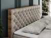 A close-up view of a tufted headboard of a boxspring bed with a wooden frame, with pillows in the foreground. Produktbild-Vorschau