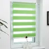 A green and white striped roller blind is shown in a window.