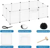 A white pet enclosure with various accessories laid out around it, including zip ties, mats, connectors, panels, a wire door, and a mallet. Voir les images du produit
