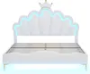 A white bed with a crown-shaped headboard and blue LED lighting. Náhľad obrázku produktu