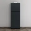 A dark gray shoe cabinet with three drawers stands against a light gray wall, with a pair of glasses and books on top. Produktbild-Vorschau
