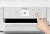 A hand is shown pressing buttons on the control panel of an Epson WorkForce Pro WF-M4119DW printer. Náhľad obrázku produktu