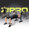 A man is performing a bench press exercise on a black weight bench, with another man standing in the background. The word "ZIPRO" is prominently displayed in large yellow letters behind them. Náhled obrázku produktu
