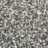 A close-up, overhead view of small, mixed-color gravel or pebbles. Produktbild-Vorschau