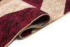 A close-up of a rolled-up rug showing its texture and pattern. Anteprima dell’immagine prodotto