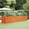 A wooden planter box filled with purple flowers in a garden setting with a patio umbrella in the background. Náhľad obrázku produktu