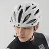 A close-up shot of a man wearing a white bicycle helmet. Produktbild-Vorschau