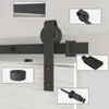 A collage of close-up shots of a black barn door sliding hardware kit, showing various components and details. Produktbild-Vorschau
