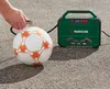 A person is using a portable air compressor to inflate a soccer ball. Produktbild-Vorschau