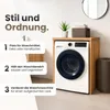 A washing machine is shown inside a wooden cabinet, with text overlays describing its features. Voir les images du produit