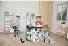 Children playing with a toy laundry set in a room. Produktbild-Vorschau