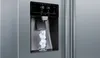 A close-up shot of a refrigerator's ice and water dispenser with a glass being filled with ice. Náhled obrázku produktu