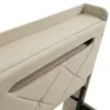 A close-up view of the upholstered headboard of a bed, showing the stitching detail and a storage compartment. Produktbild-Vorschau