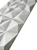 A close-up, angled view of two textured, geometric wall panels. Anteprima dell’immagine prodotto