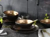 A table setting with plates and bowls, suggesting a dining or serving context. Náhľad obrázku produktu