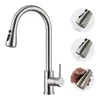 A stainless steel kitchen faucet with a pull-down sprayer is shown against a white background. Insets demonstrate the sprayer's different spray modes and how it is held. Produktbild-Vorschau