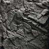 A close-up, textured view of a stone or granite surface, showing the rough, uneven details of the material. Anteprima dell’immagine prodotto