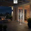 A balcony at night with a decorative LED tree and city lights in the background. Podgląd zdjęcia produktu