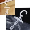 Collage of close-up shots of a white plastic vacuum seal bag hanger and a hand pump. Anteprima dell’immagine prodotto