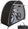 A bicycle is stored inside a portable tent-like shelter. Anteprima dell’immagine prodotto