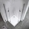 A shower cabin with glass doors and white base, set against marble-patterned walls and gray tiled floor. Produktbild-Vorschau