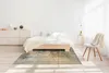 Designteppich ausgelegt im Schlafzimmer.  Produktbild-Vorschau