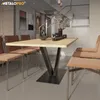 A dining room setting with a table and chairs. Voir les images du produit