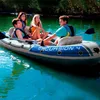 Four people are enjoying a day on the water in an inflatable boat. Podgląd zdjęcia produktu