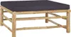 A square bamboo coffee table with a dark gray cushion. Produktbild-Vorschau