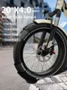 Close-up of an electric bicycle tire with text overlays describing its features. Produktbild-Vorschau
