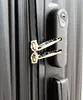 A close-up view of the zipper and combination lock on a black suitcase. Produktbild-Vorschau