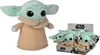 A plush toy of 'The Child' from Star Wars is shown next to a box containing multiple smaller versions of the same toy. Produktbild-Vorschau