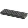 A folded black foam cushion with a textured surface. Produktbild-Vorschau