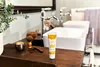 A bathroom vanity with a tube of cream, shaving brush, razor, and bowl. Anteprima dell’immagine prodotto
