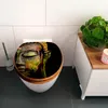 A toilet seat with a colorful Buddha design is shown in a bathroom setting. Podgląd zdjęcia produktu
