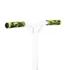 Close-up of the handlebars of a white stunt scooter with green and black grips. Náhled obrázku produktu