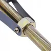 A close-up view of a metal tool with a threaded rod and a hexagonal nut. Anteprima dell’immagine prodotto