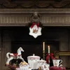 A festive Christmas display on a fireplace mantel, featuring decorative tableware, a rocking horse, and candles. Produktbild-Vorschau