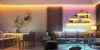 A modern living room and dining area with colorful LED strip lighting. Anteprima dell’immagine prodotto