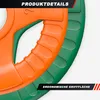Close-up view of two weight plates, one orange and one green, with textured grips. Produktbild-Vorschau