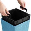 Hands are shown inserting a black plastic liner into a blue textured planter. Anteprima dell’immagine prodotto