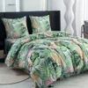 A bed with tropical-themed bedding. Náhľad obrázku produktu