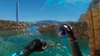 A first-person perspective of a virtual reality game scene, showing a futuristic landscape with a body of water and a tall, slender tower in the distance. Podgląd zdjęcia produktu