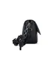 A black handbag with a chain strap and a small attached pouch, shown from the side against a white background. Produktbild-Vorschau