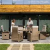 A couple is standing around a patio dining set on a sunny day. Náhled obrázku produktu